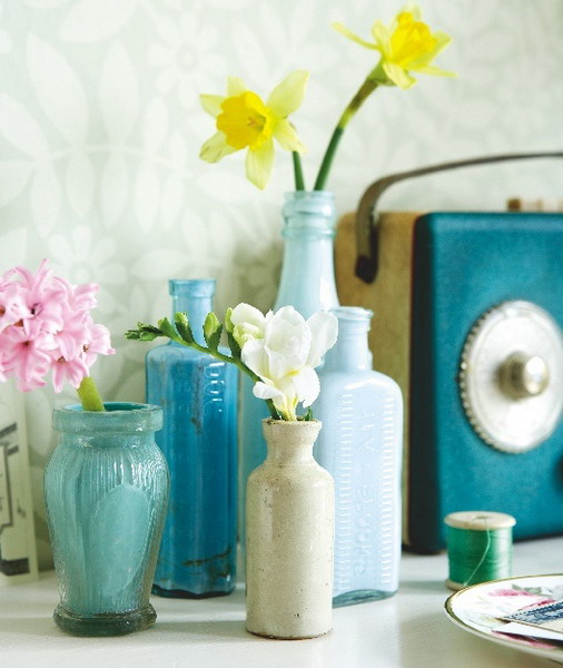 Bright vases with fresh flowers