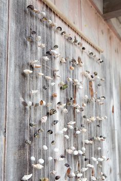 Pendants on the door with their own hands from seashells
