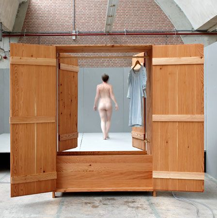 original wooden indoor bath with a closet