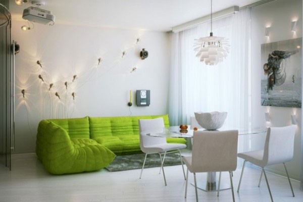 Green sofa - the only bright detail of a white living room
